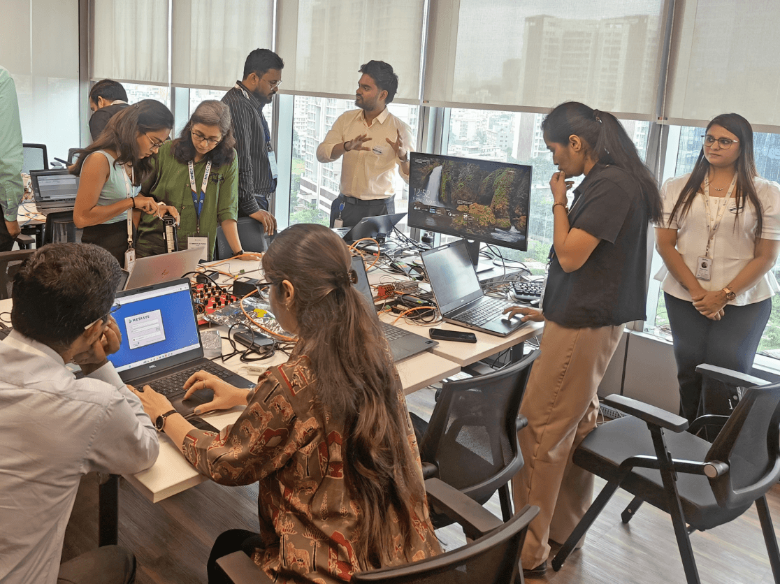 Engineers collaborating during interoperability testing